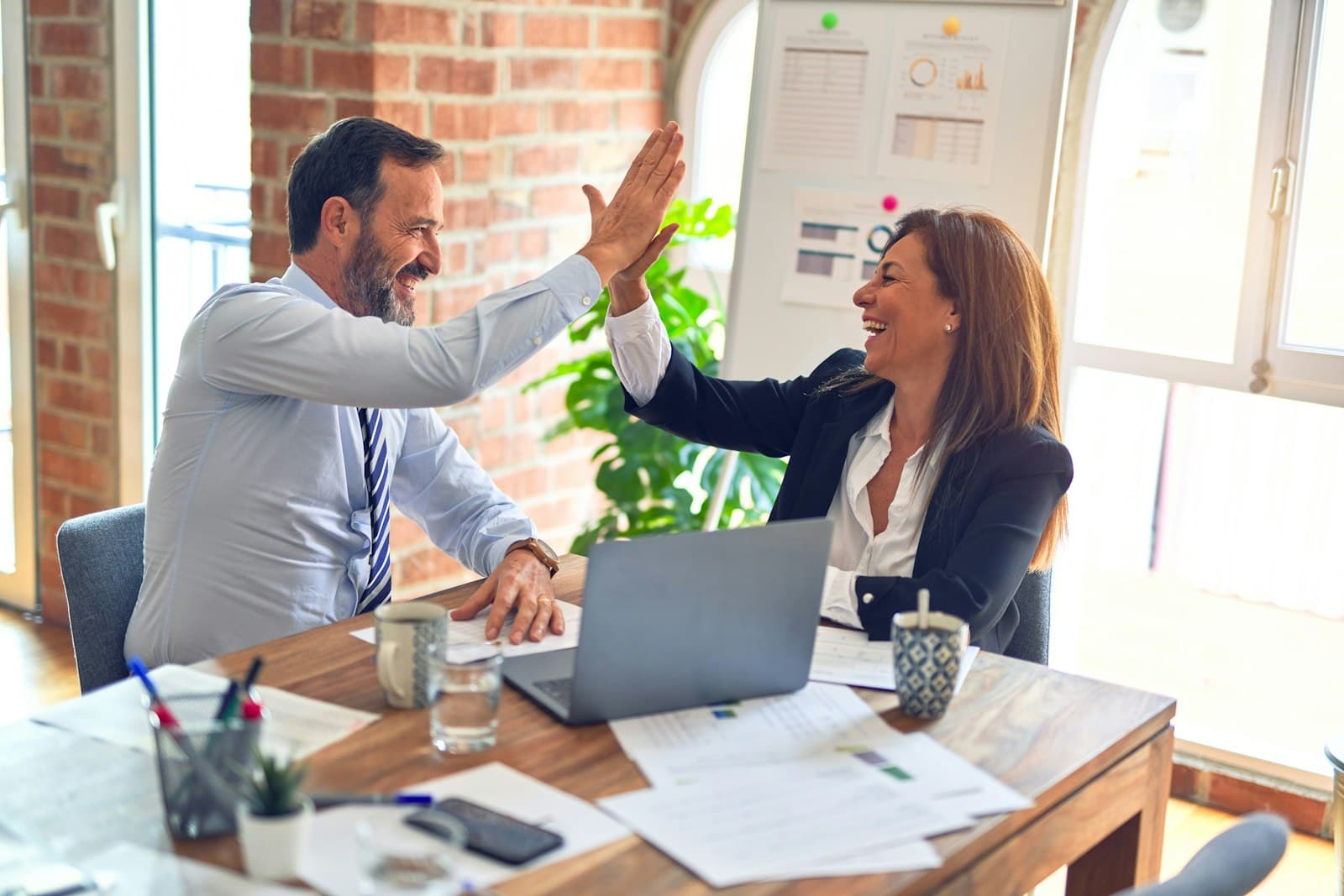 Two business partners celebrating a successful agreement